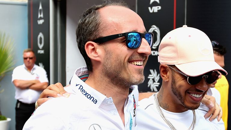 Lewis Hamilton of Great Britain and Mercedes GP greets Robert Kubica of Poland and Williams in the Paddock before the Monaco Formula One Grand Prix at Circuit de Monaco on May 27, 2018 in Monte-Carlo, Monaco.