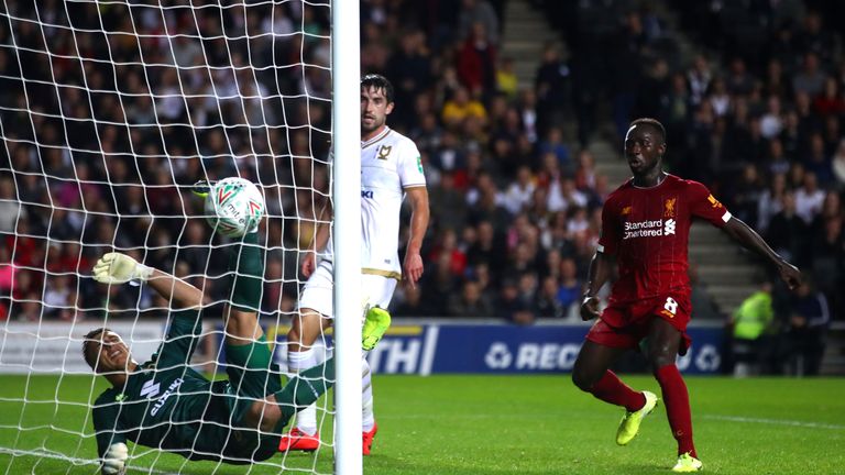 A goalkeeping howler from MK Dons 'keeper Stuart Moore saw Liverpool take the lead through James Milner