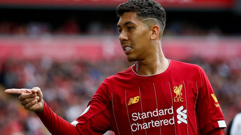 Liverpool forward Roberto Firmino gesticulating at a fan during the Premier League match against Newcastle