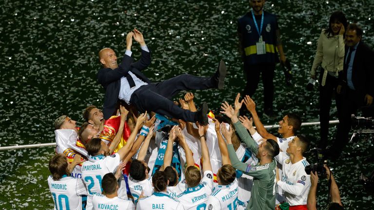 Real Madrid head coach Zinedine Zidance celebrating his third successive Champions League triumph, beating Liverpool in the final