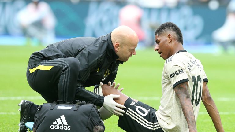 Marcus Rashford receives treatment after picking up an injury during Manchester United&#39;s match against West Ham