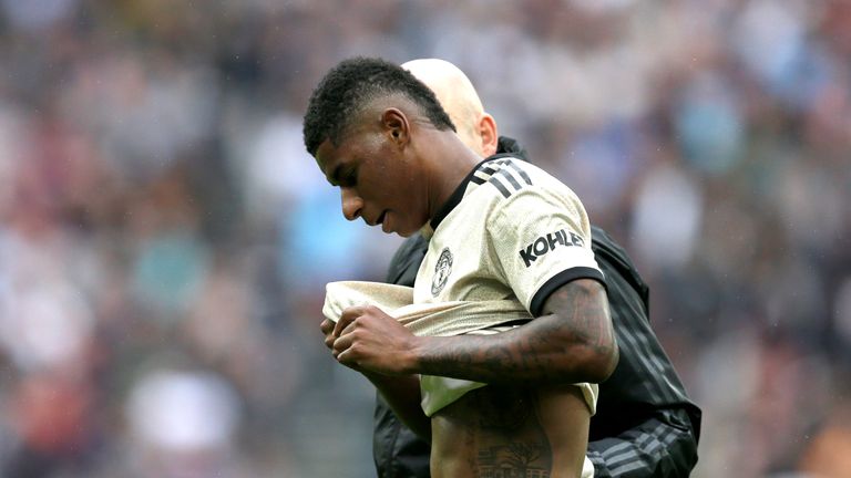 Marcus Rashford receives treatment after picking up an injury during Manchester United&#39;s match against West Ham