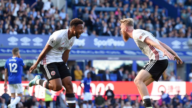 Mousset celebrates after scoring his team's second goal with Oliver McBurnie