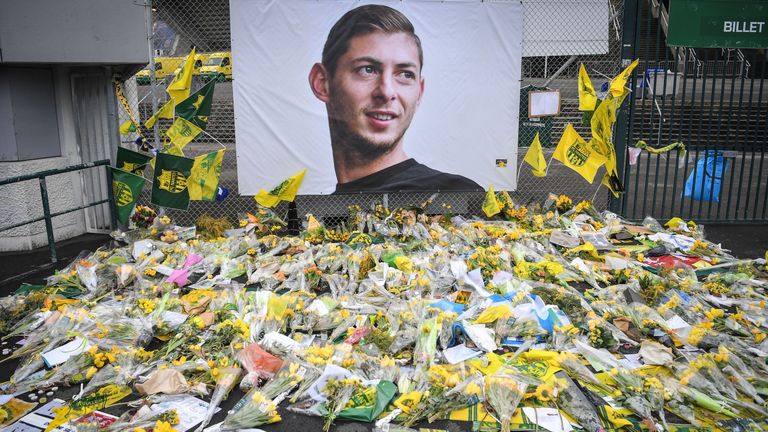 Yellow flowers are displayed in front of the portrait of Argentinian forward Emiliano Sala at the Beaujoire stadium in Nantes