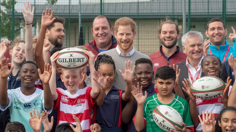 The Duke of Sussex poses for a photo during his visit to Lealands High School in Luton