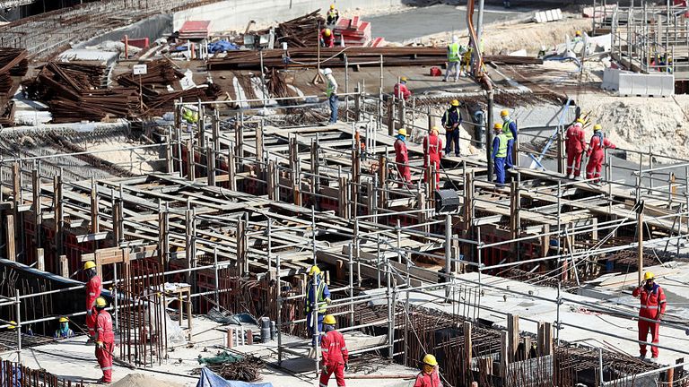 Workers at the construction site of the Al Bayt Stadium in Doha, Qatar