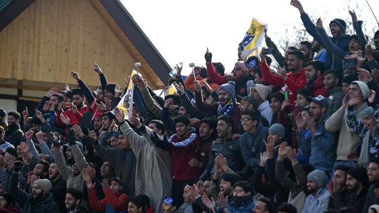 Real Kashmir's fans cheer during their I-League club football match against Chennai City FC at the Tourist Reception Centre football ground in Srinagar