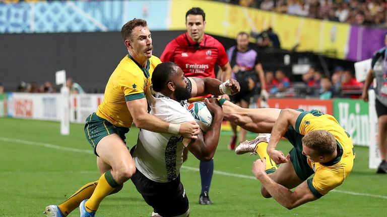 Australia's Reece Hodge hits Fiji's Peceli Yato with a high tackle during their Rugby World Cup, Pool D match in Sapporo