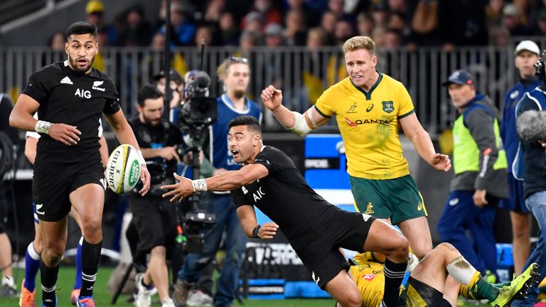 Richie Mo’unga of the All Blacks makes the offload against Australia