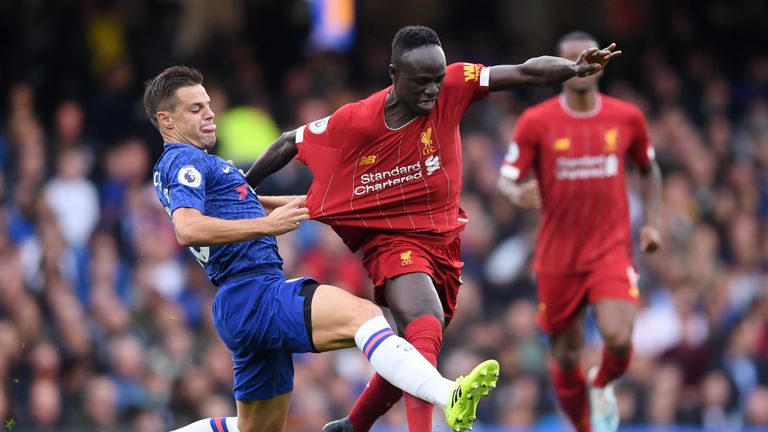 Sadio Mane has his shirt pulled by Cesar Azpilicueta