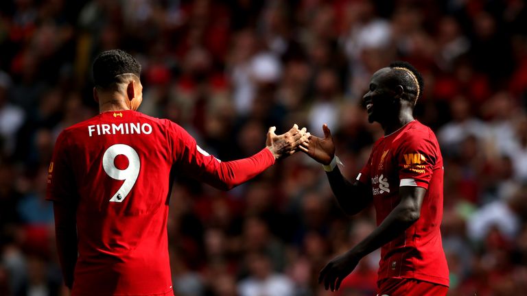 Sadio Mane celebrates with Roberto Firmino after he scores Liverpool's second goal