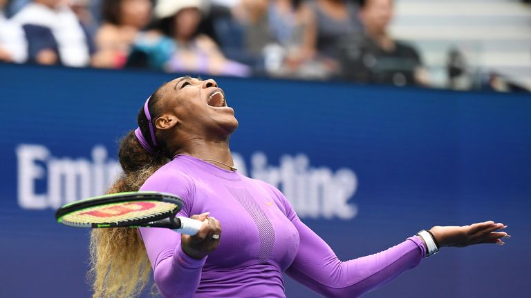 Serena Williams held her arms out wide after serving an ace during the early stages of the second set
