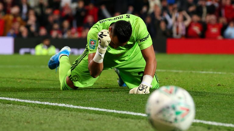 Goalkeeper, Sergio Romero of Manchester United makes a save in the penalty shoot out during the Carabao Cup Third Round match between Manchester United and Rochdale AFC at Old Trafford