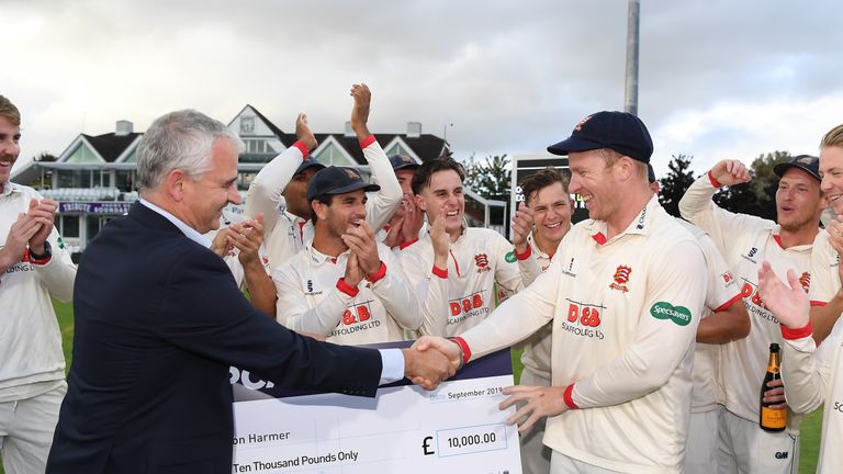 Essex's Simon Harmer receives his winner's cheque from PCA chief executive David Leatherdale