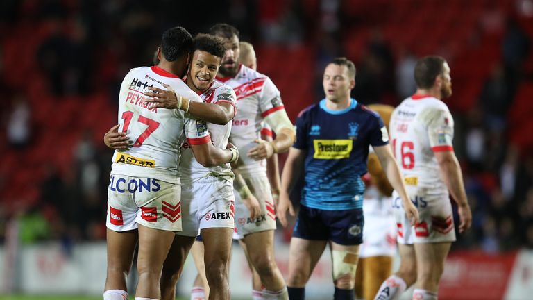 Picture by John Clifton/SWpix.com - 27/09/2019 - Rugby League - Betfred Super League Semi Final - St Helens v Wigan Warriors - The Totally Wicked Stadium, Langtree Park, St Helens, England -
St Helens' Dom Peyroux and Regan Grace celebrate after the match