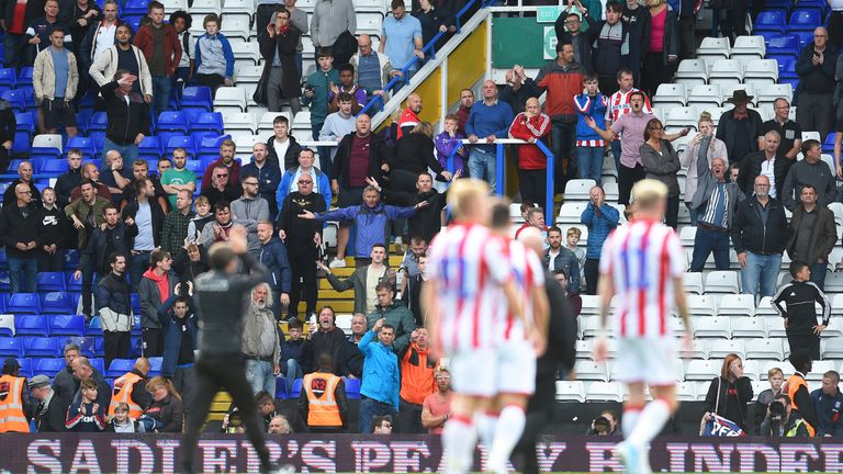 Stoke City manager Nathan Jones and his players greet the fans following their game against Birmingham City