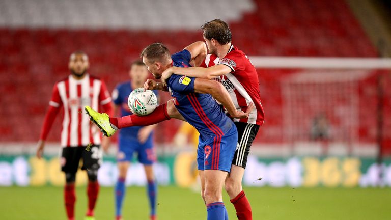 Sunderland's Charlie Wyke (left) and Sheffield United's Richard Stearman (right) battle for the ball during the Carabao Cup, Third Round match at Bramall Lane