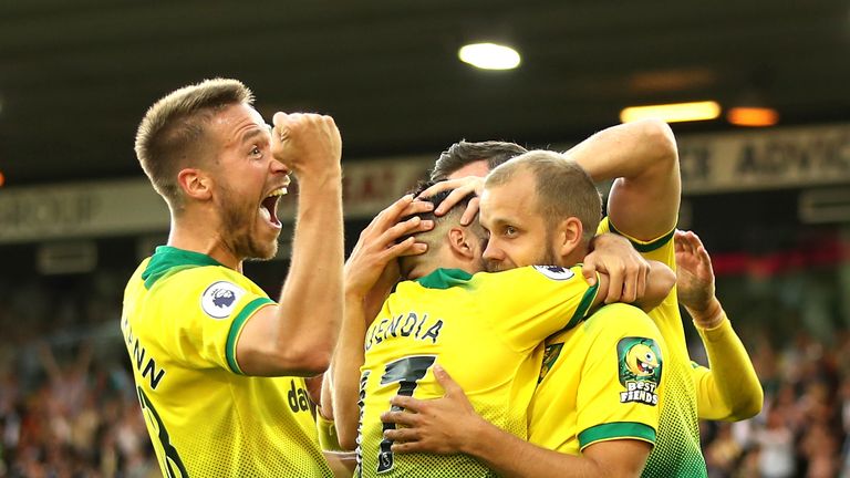 Teemu Pukki is mobbed by his team-mates after putting Norwich 3-1 up
