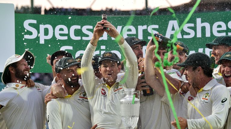 Tim Paine lifts the Ashes urn at The Oval after the 2019 series ends 2-2