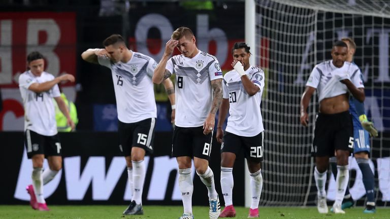 Toni Kroos (No 8) and his Germany team-mates react after conceding to the Netherlands
