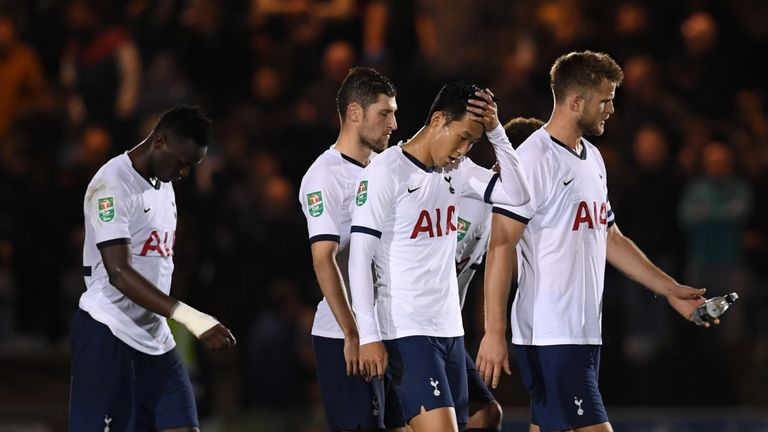 Tottenham Hotspur's Son Heung-min and players look dejected after the defeat