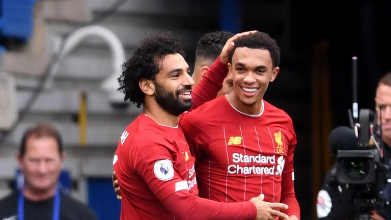 Trent Alexander-Arnold is congratulated by Mohamed Salah