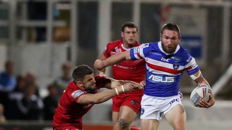 Wakefield's Tyler Randell runs through the Broncos defence