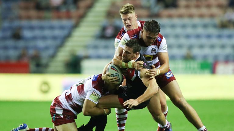 Picture by Oskar Vierod/SWpix.com - 20/09/2019 - Rugby League - Betfred Super League Qualifying Final - Wigan Warriors v Salford Red Devils - DW Stadium, Wigan, England - Salford Red Devils' Tyrone McCarthy is tackled