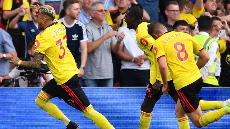 Roberto Pereyra celebrates his penalty to level the score against Arsenal