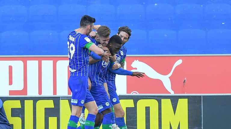 Wigan Athletic's Cheyenne Dunkley celebrates scoring his second goal