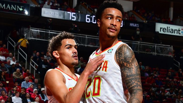 Trae Young and John Collins in action for Atlanta during the 2018-19 season