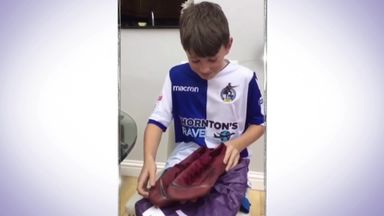 Young fan gets boots from hero