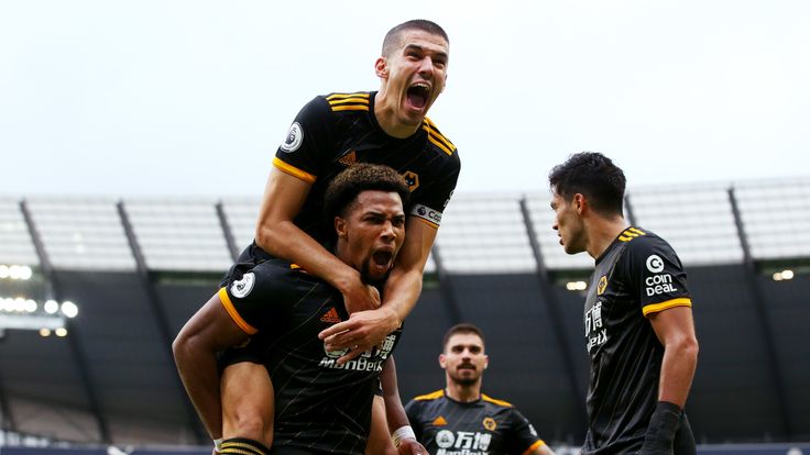 Adama Traore and his Wolves team-mates celebrate after taking the lead at Man City