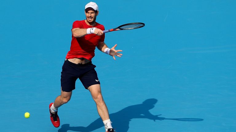Andy Murray fires a ferocious forehand during his match with compatriot Cameron Norrie