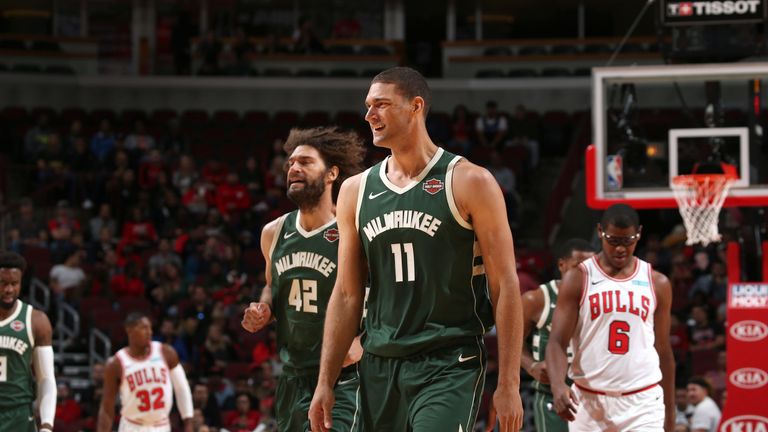 Brook Lopez and brother Robin on court during the Milwaukee Bucks' preseason opener in Chicago