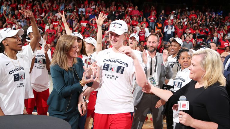 Emma Meesseman receives the Finals MVP award from WNBA commissioner Cathy Engelbert