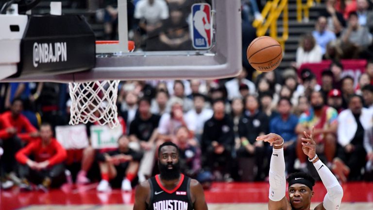 James Harden watches Russell Westbrook shoot a free throw against Toronto