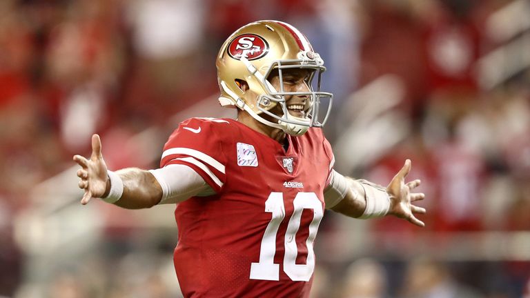 Quarterback Jimmy Garoppolo celebrates after throwing a touchdown pass to George Kittle