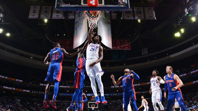 Joel Embiid powers home a dunk against Pistons