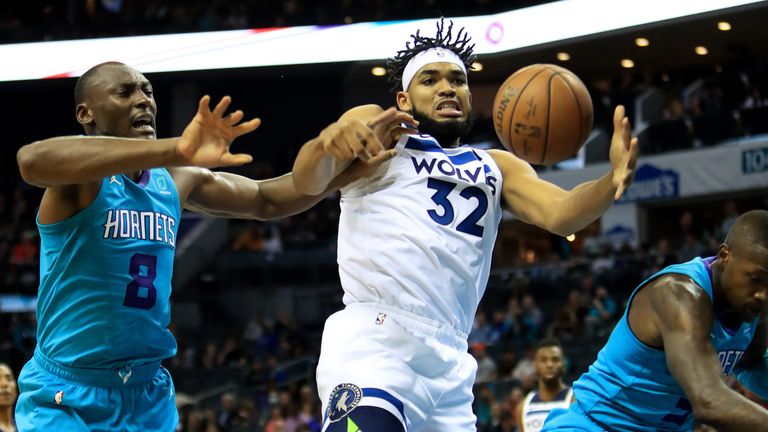 Karl-Anthony Towns battles for a rebound against Charlotte