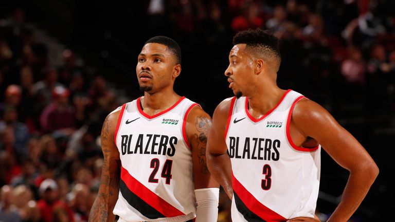 Kent Bazemore shares a word with team-mate CJ McCollum