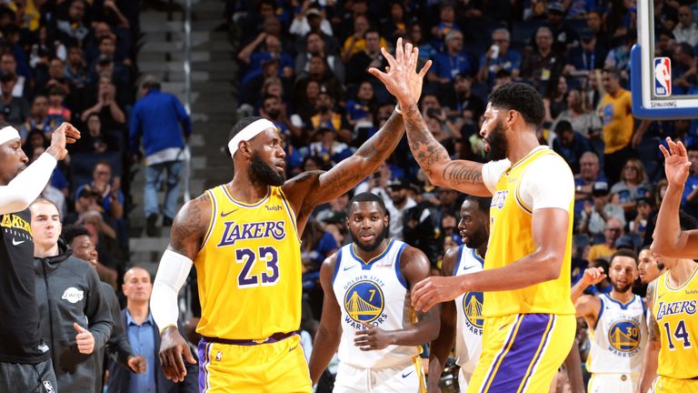 LeBron James and Anthony Davis high-five after scoring against Golden State