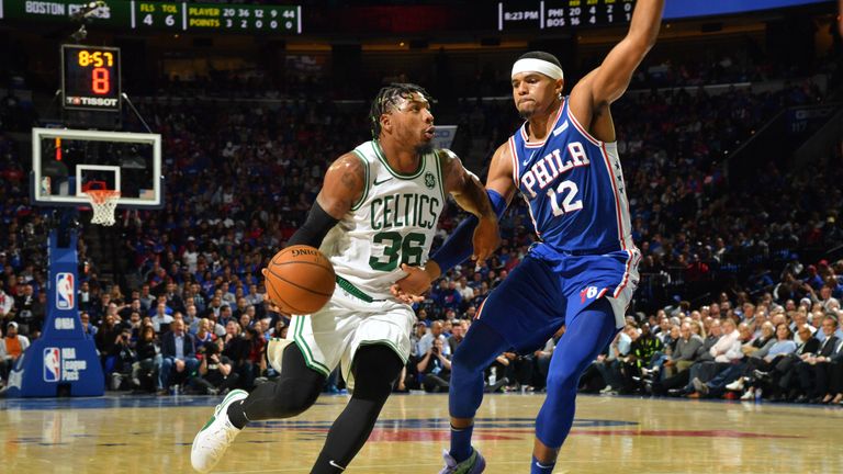 Marcus Smart is guarded by Tobias Harris
