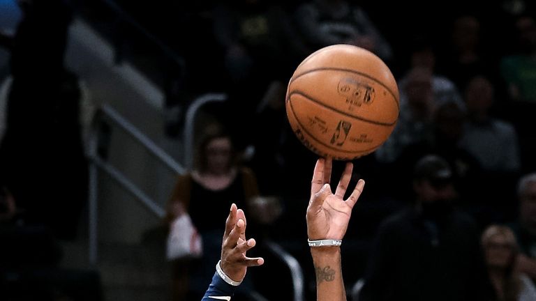 Mike Conley lofts a jump shot for the Jazz