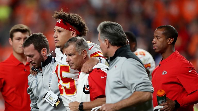 Chiefs quarterback Patrick Mahomes is helped from the field
