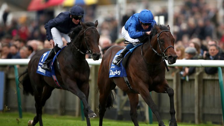 Pinatubo ridden by William Buick (right) wins the Darley Dewhurst Stakes 
