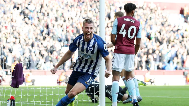 Adam Webster wheels away in celebration after his opener at Villa Park