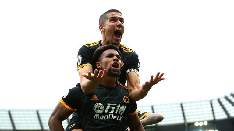 Adama Traore celebrates with Conor Coady after scoring the first of his two goals against Man City
