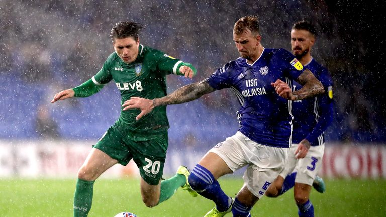 Cardiff City's Aden Flint (right) and Sheffield Wednesday's Adam Reach (left) 