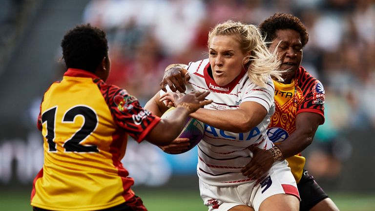 SYDNEY, AUSTRALIA - OCTOBER 18: Amy Hardcastle of England is tackled during the round 1 Rugby League World Cup 9s match between Papua New Guinea and England at Bankwest Stadium on October 18, 2019 in Sydney, Australia. (Photo by Brett Hemmings/Getty Images)